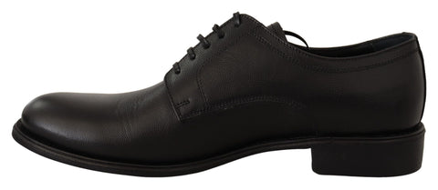 Black leather lace-up men's formal derby shoes by Dolce & Gabbana, featuring a polished finish and classic design.