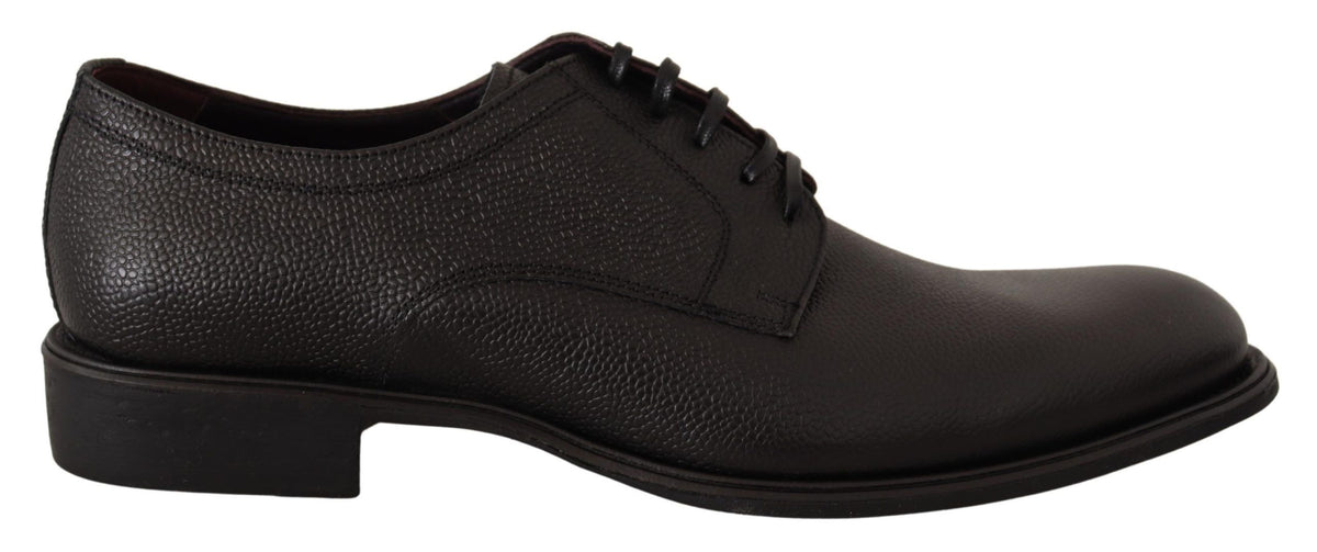 Black leather lace-up men's formal derby shoes by Dolce & Gabbana, featuring sleek design and polished finish.
