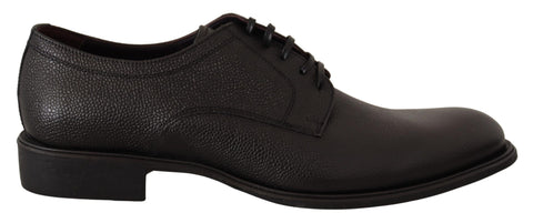 Black leather lace-up men's formal derby shoes by Dolce & Gabbana, featuring sleek design and polished finish.