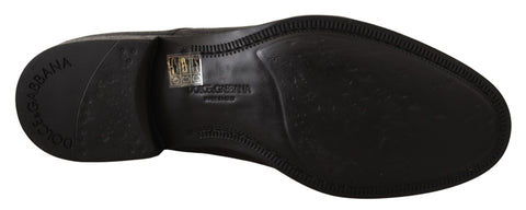 Black leather lace-up men's formal derby shoes by Dolce & Gabbana, featuring sleek design and polished finish.