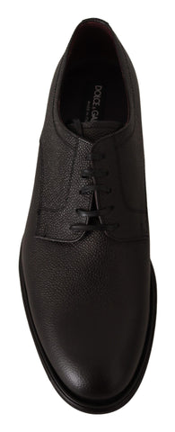 Black leather lace-up men's formal derby shoes by Dolce & Gabbana, featuring sleek design and polished finish.