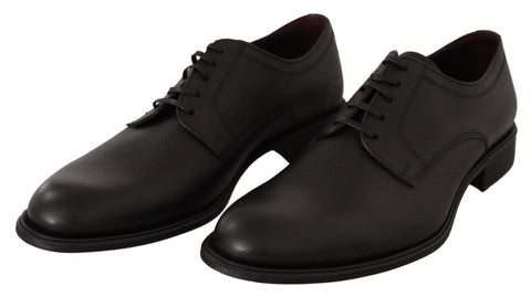 Black leather lace-up men's formal derby shoes by Dolce & Gabbana, featuring sleek design and polished finish.