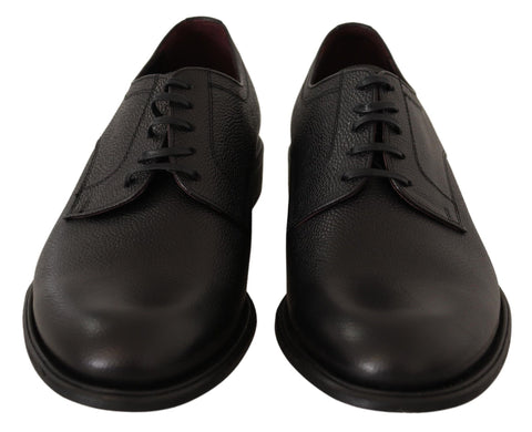 Black leather lace-up men's formal derby shoes by Dolce & Gabbana, featuring polished finish and classic design.