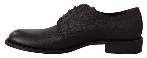 Black leather lace-up men's formal derby shoes by Dolce & Gabbana, featuring classic design and polished finish.