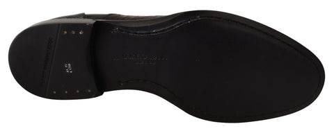 Black leather exotic skins formal shoes by Dolce & Gabbana with sleek design and polished finish.