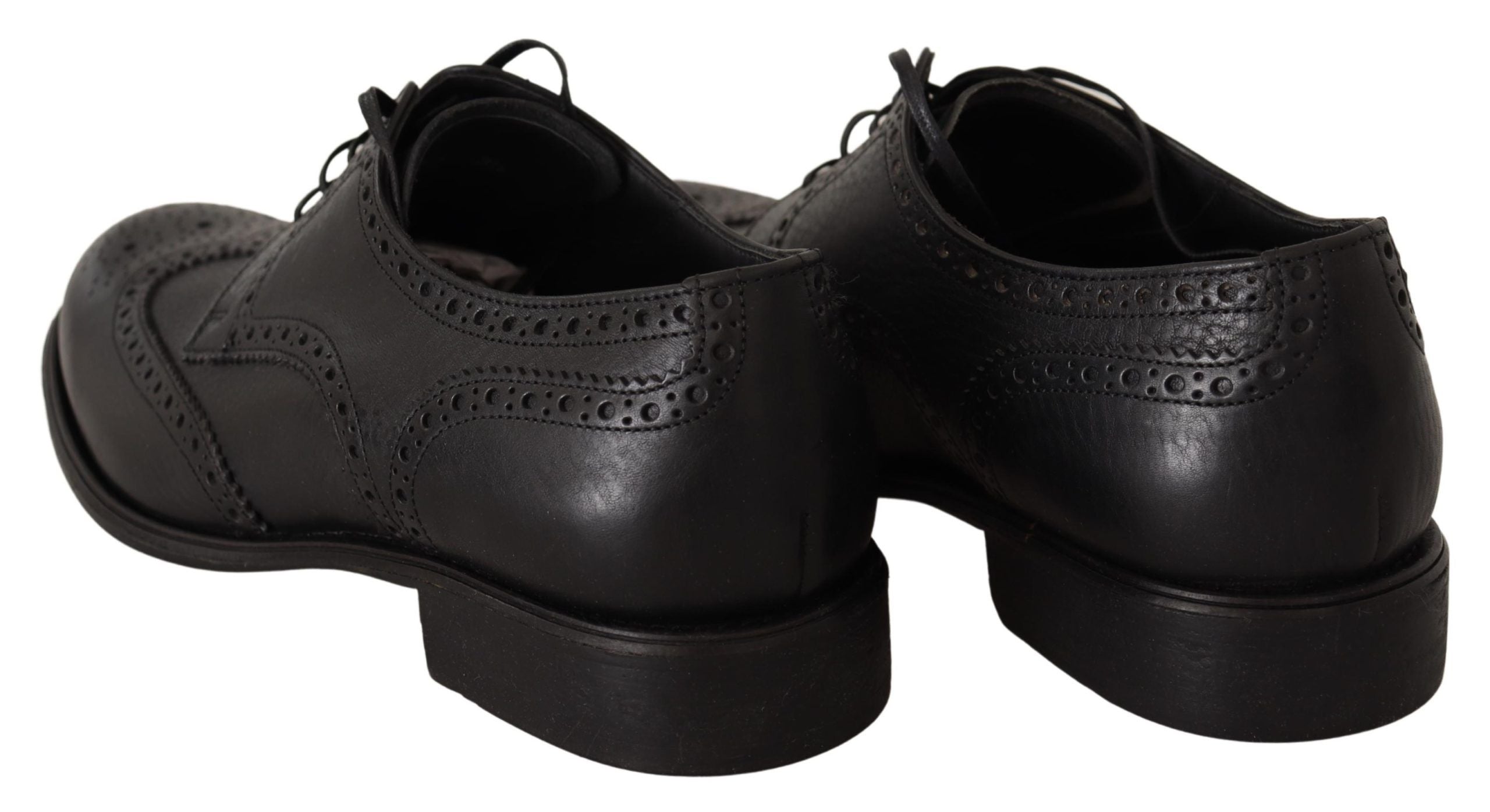 Black leather Oxford wingtip dress shoes by Dolce & Gabbana, featuring classic formal design and detailed brogue accents.