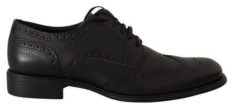 Black leather Oxford wingtip formal dress shoes by Dolce & Gabbana, featuring classic wingtip detailing and sleek design.