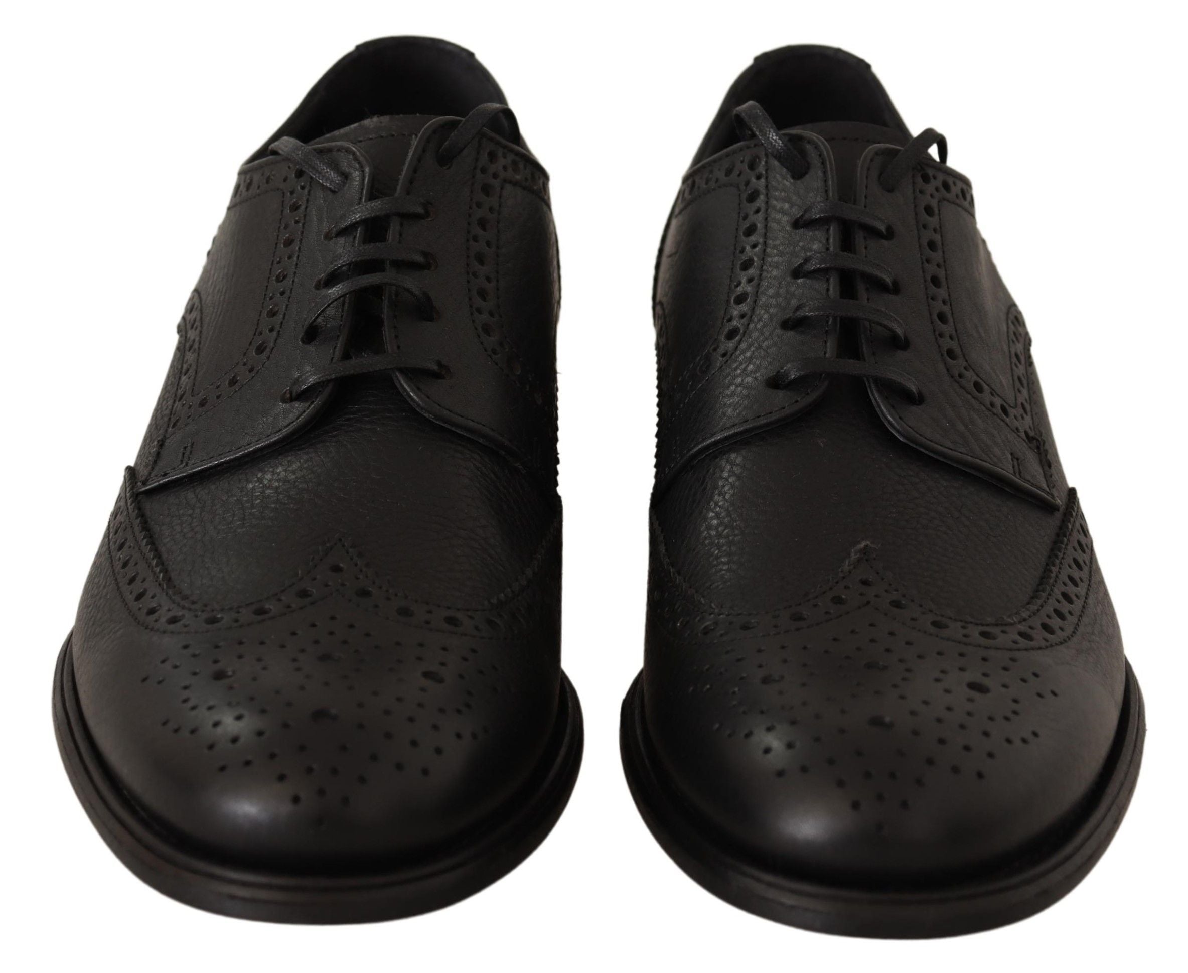 Dolce & Gabbana black leather Oxford wingtip formal dress shoes, detailed broguing and sleek design, on a plain background.