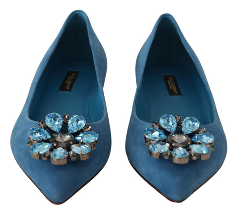 Blue suede Dolce & Gabbana loafers with crystal embellishments, flat shoe style, shown from a front angle on a white background.