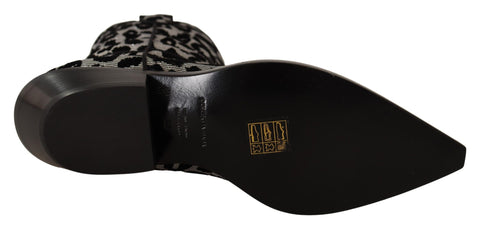 Gray and black leopard print cowboy boots by Dolce & Gabbana showing pointed toes and western-style heel.