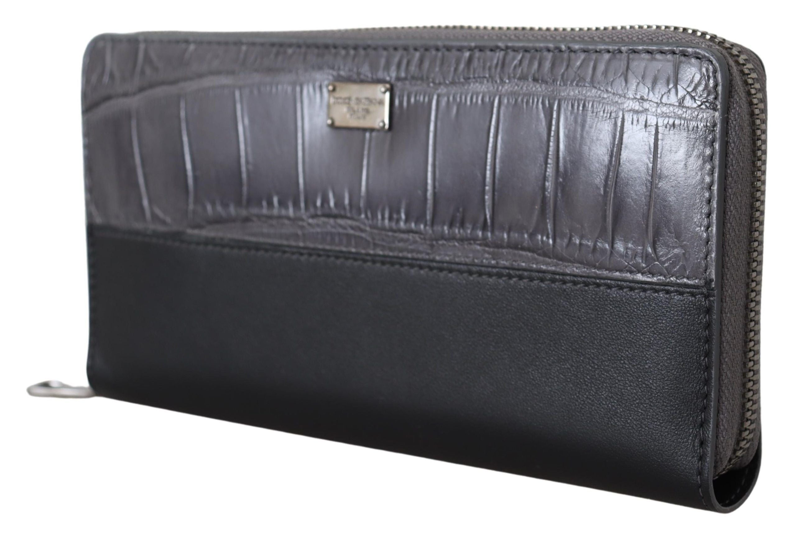 Black leather zip-around continental clutch wallet by Dolce & Gabbana with multiple card slots and a sleek, compact design.