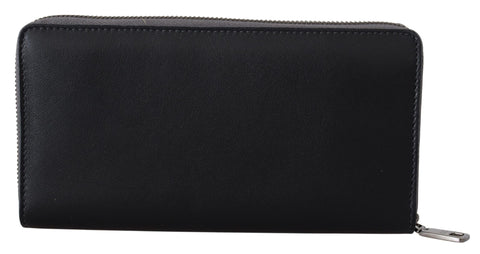 Black zip around leather wallet clutch by Dolce & Gabbana with multiple card slots and sleek design.