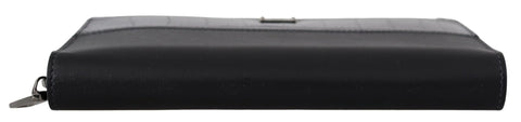 Black Dolce & Gabbana zip-around leather clutch wallet with continental design and multiple card slots.