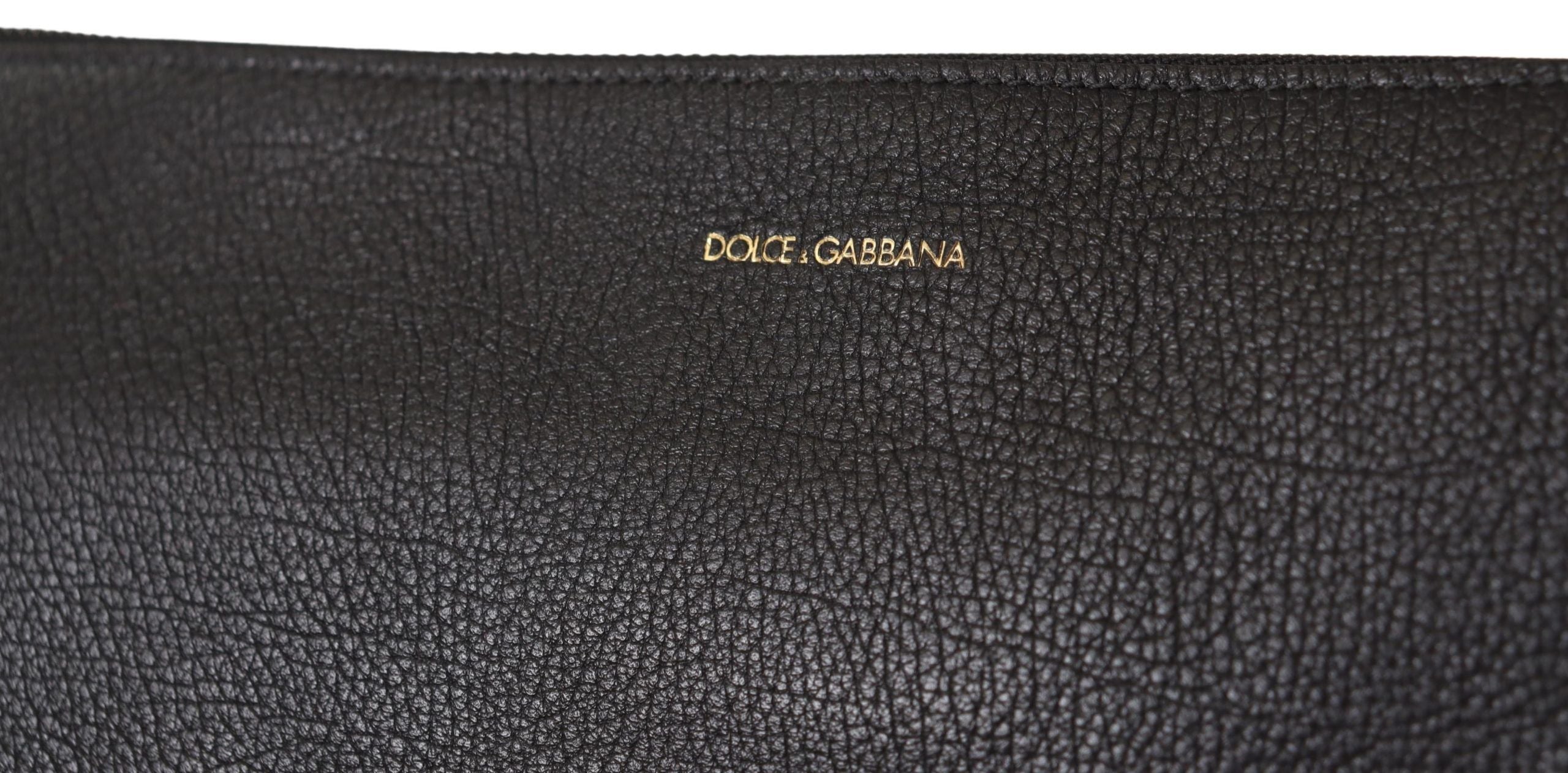 Black exotic leather shoulder sling bag by Dolce & Gabbana with sleek design and adjustable strap.