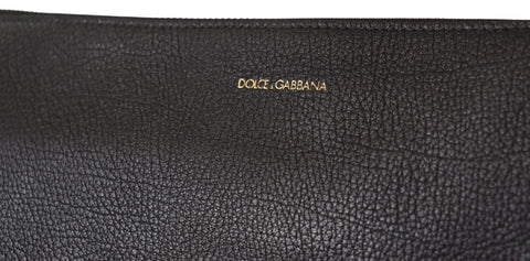 Black exotic leather shoulder sling bag by Dolce & Gabbana with sleek design and adjustable strap.