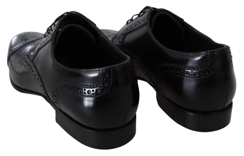 Black leather men's Derby loafers by Dolce & Gabbana, featuring sleek formal design and classic stitching details.