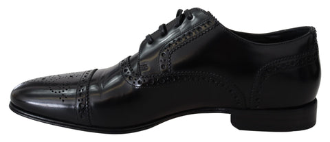 Black leather men's derby loafers by Dolce & Gabbana, featuring sleek formal design and classic craftsmanship.