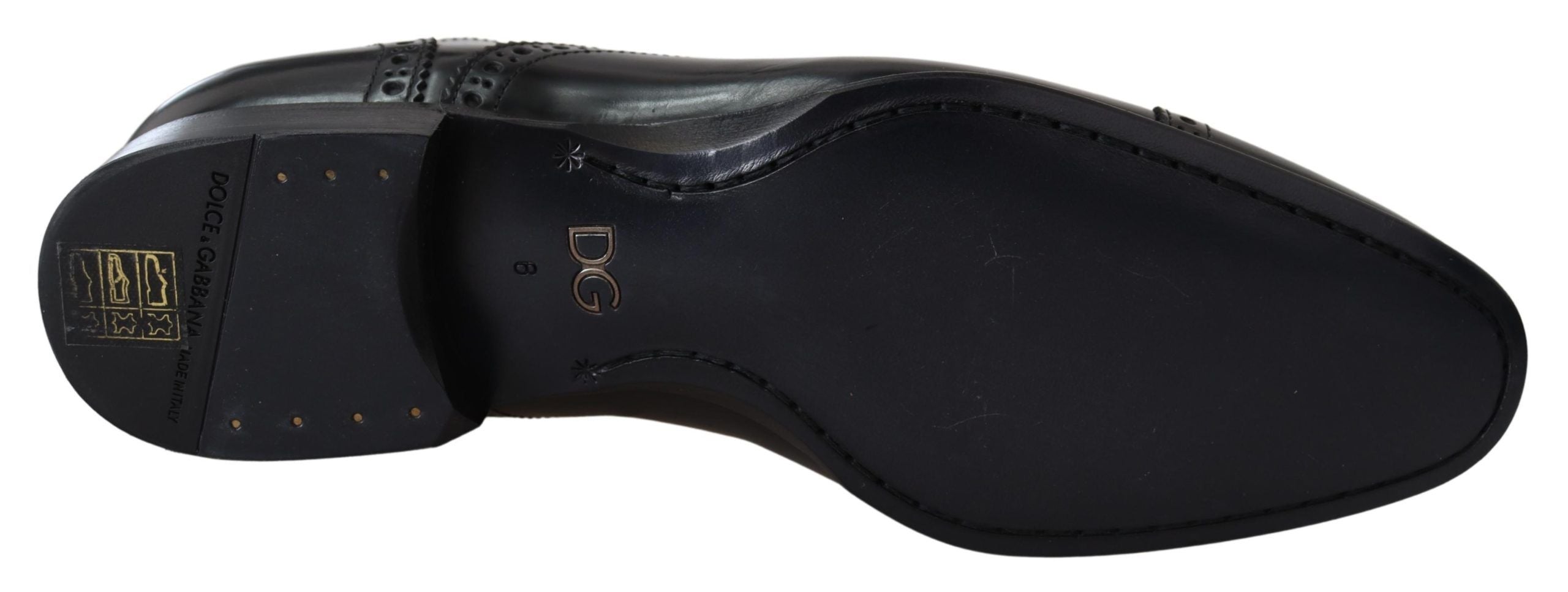 Black leather men's Derby loafers shoes by Dolce & Gabbana, featuring sleek design and polished finish.