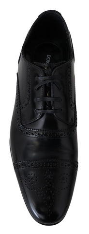 Black leather men's Derby loafers by Dolce & Gabbana, showcasing sleek formal shoe design with polished finish.