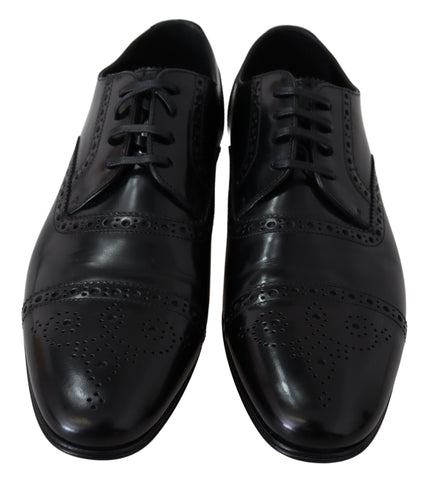 Black leather men's Derby formal loafers shoes by Dolce & Gabbana, featuring sleek design and polished finish.