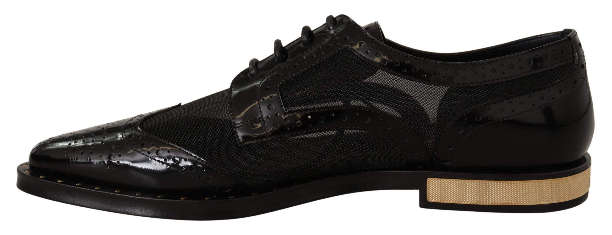 Black leather brogue wingtip shoes with sheer details from Dolce & Gabbana, showcasing classic wingtip style and craftsmanship.