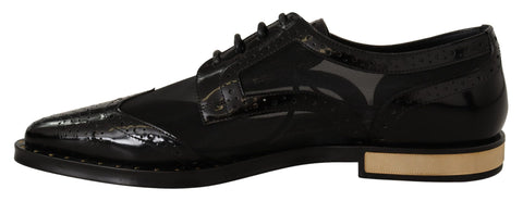 Black leather brogue wingtip shoes with sheer details from Dolce & Gabbana, showcasing classic wingtip style and craftsmanship.