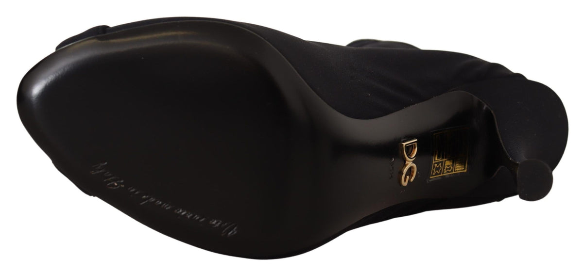Black stretch ankle boots by Dolce & Gabbana with sleek design and pointed toes, perfect for stylish everyday wear.