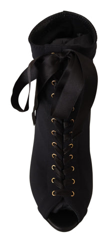 Black stretch ankle boots by Dolce & Gabbana with sleek design and pointed toes, perfect for stylish everyday wear.