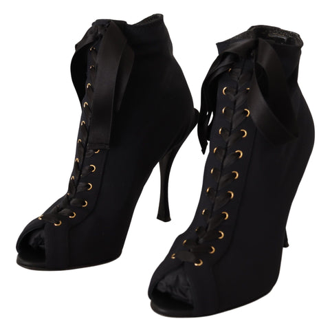 Black stretch ankle boots by Dolce & Gabbana with sleek design and smooth finish, perfect for stylish casual or dressy outfits.