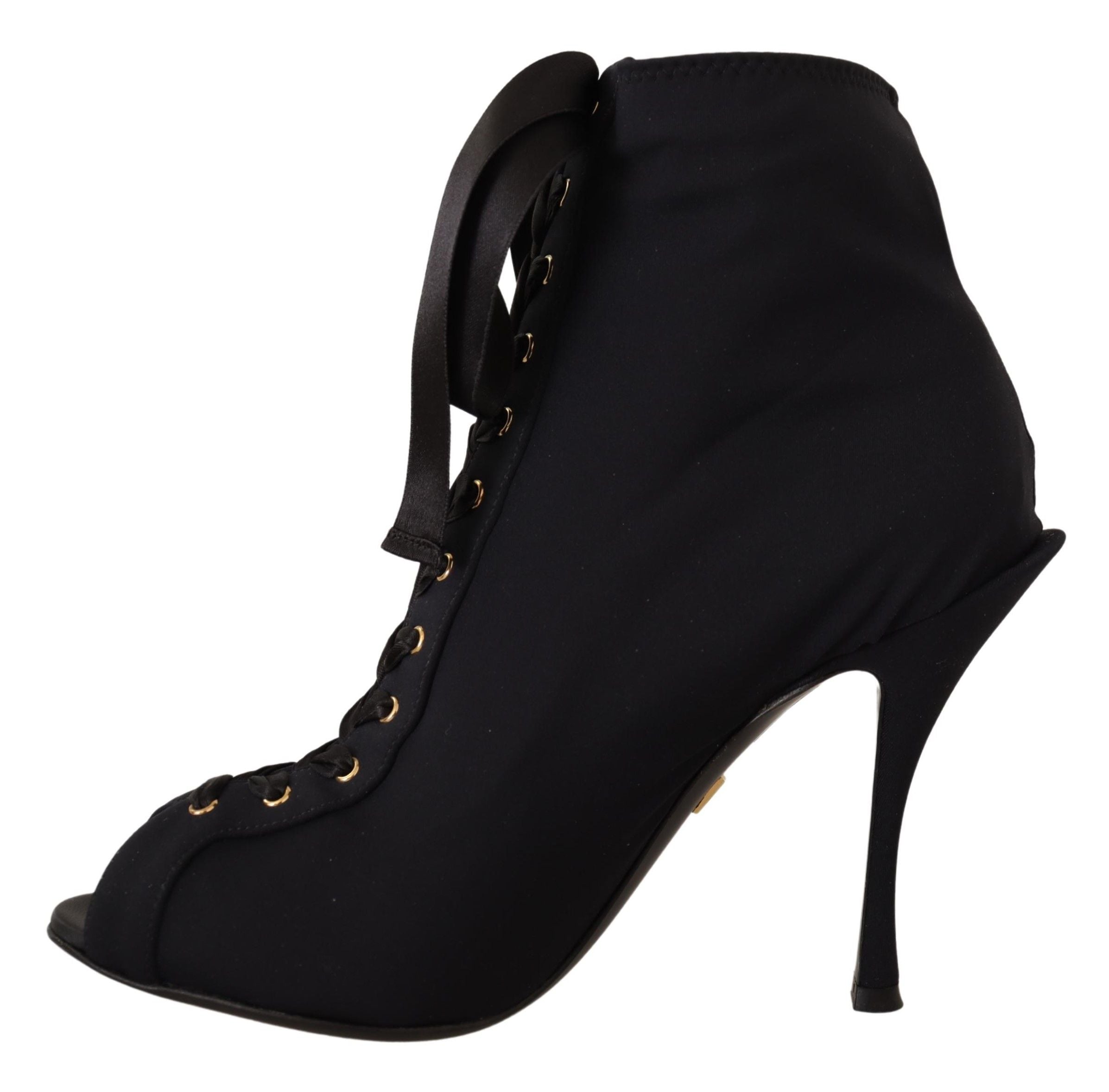 Black Dolce & Gabbana stretch short ankle boots with sleek design and pointed toes, shown on a clean, neutral background.