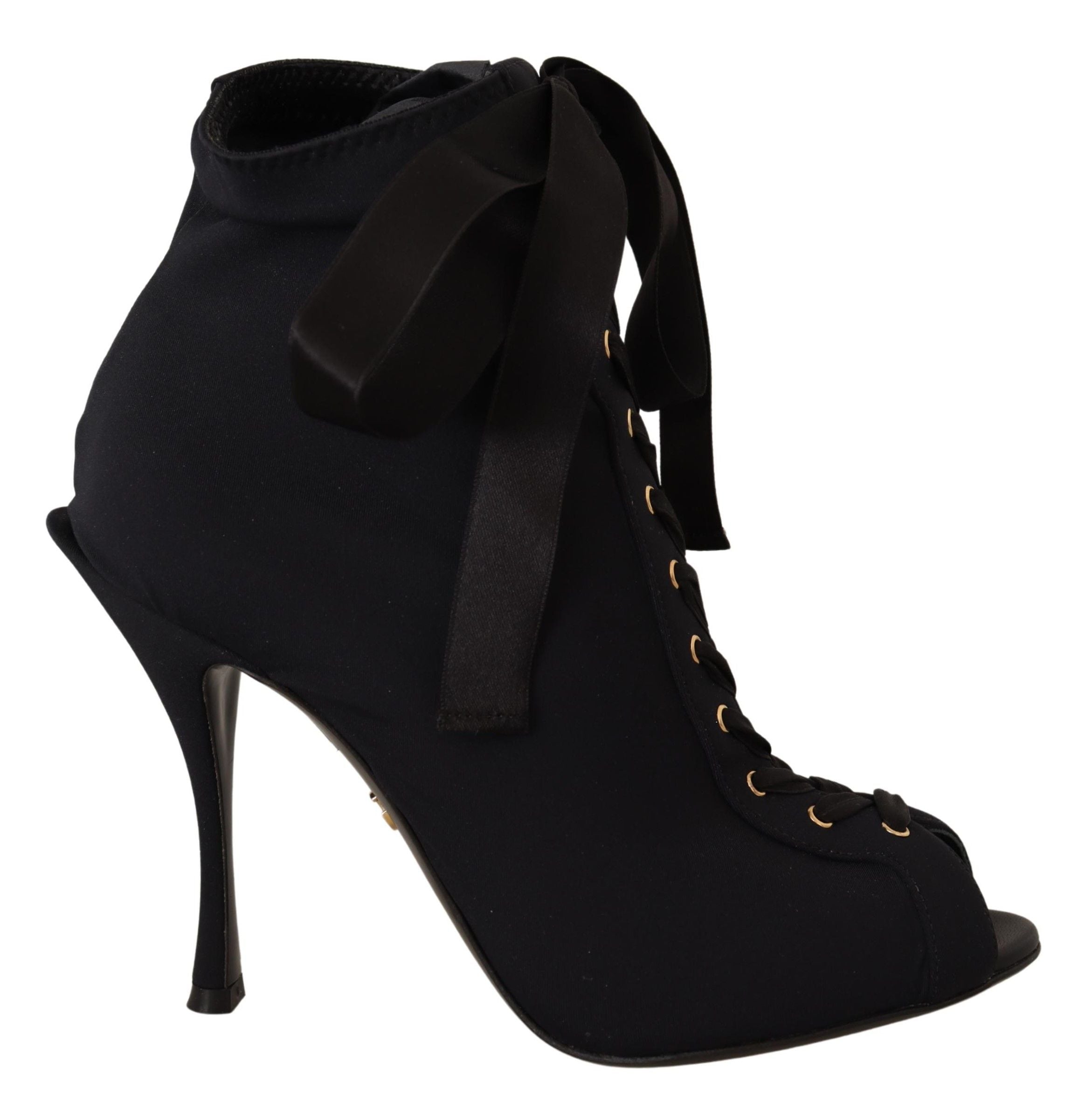 Black stretch ankle boots by Dolce & Gabbana with sleek design and pointed toes, showcasing the stylish footwear.
