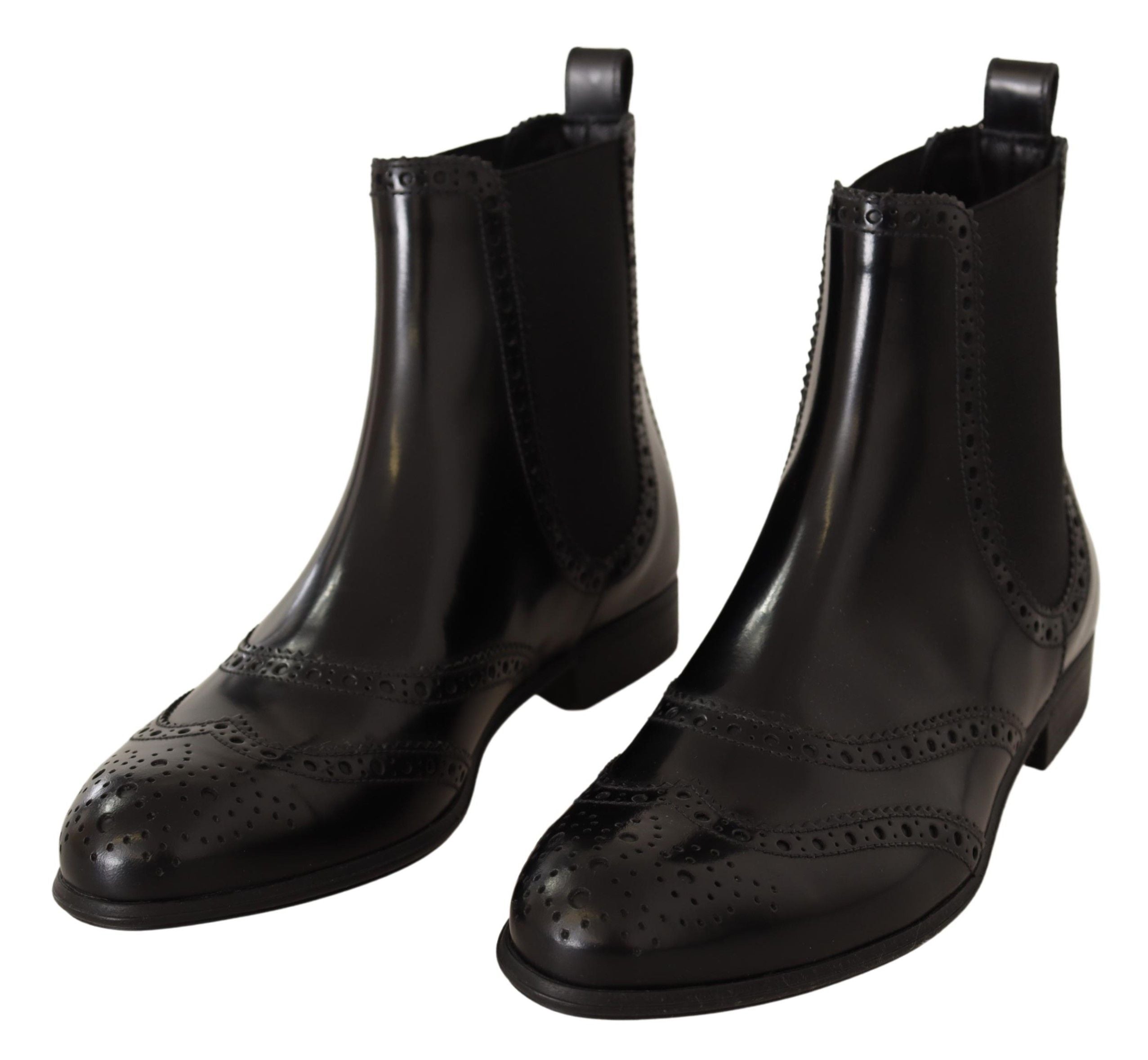 Black leather ankle-high flat boots by Dolce & Gabbana, featuring sleek design and classic silhouette.