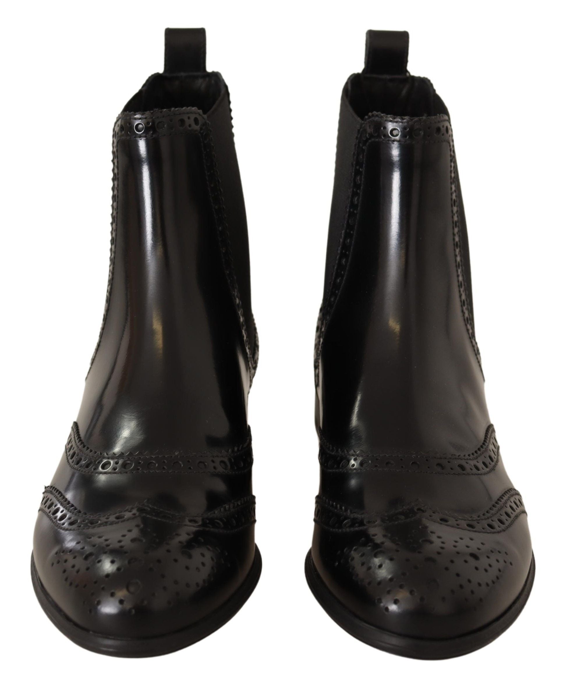 Black leather ankle high flat boots from Dolce & Gabbana with sleek design and rounded toes.