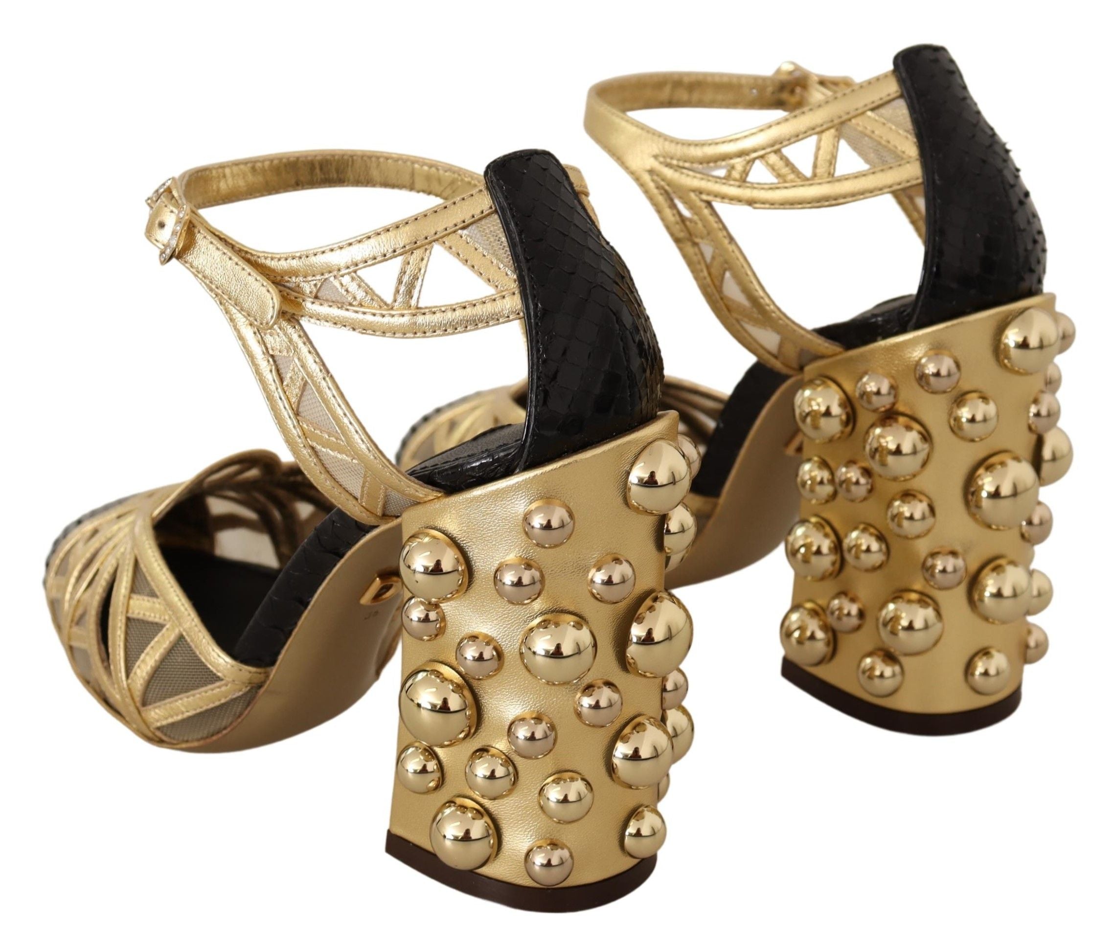 Black leather ankle strap shoes with gold studded accents by Dolce & Gabbana, featuring a sleek and stylish design.