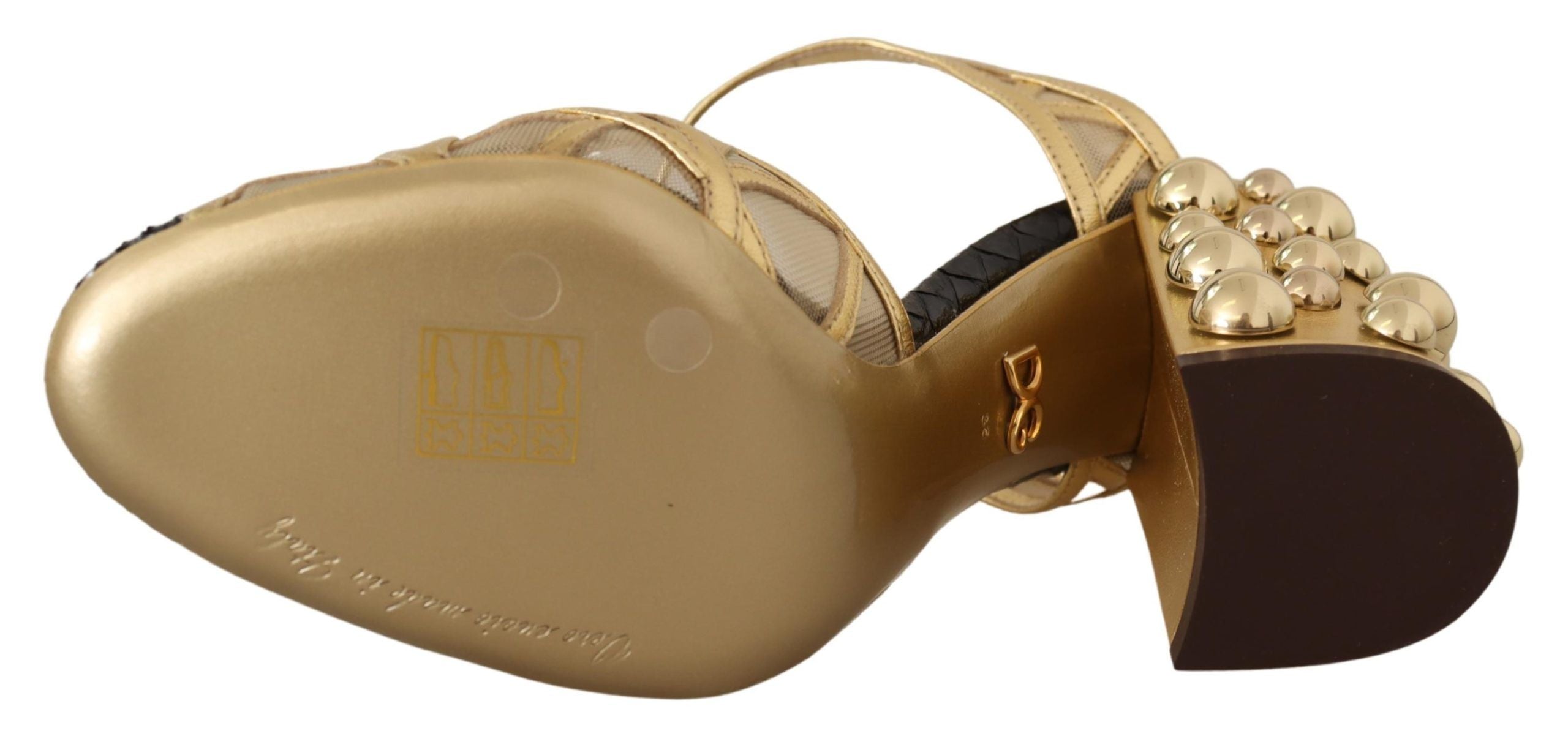 Black leather ankle strap shoes with gold studs from Dolce & Gabbana, featuring a sleek and stylish design.
