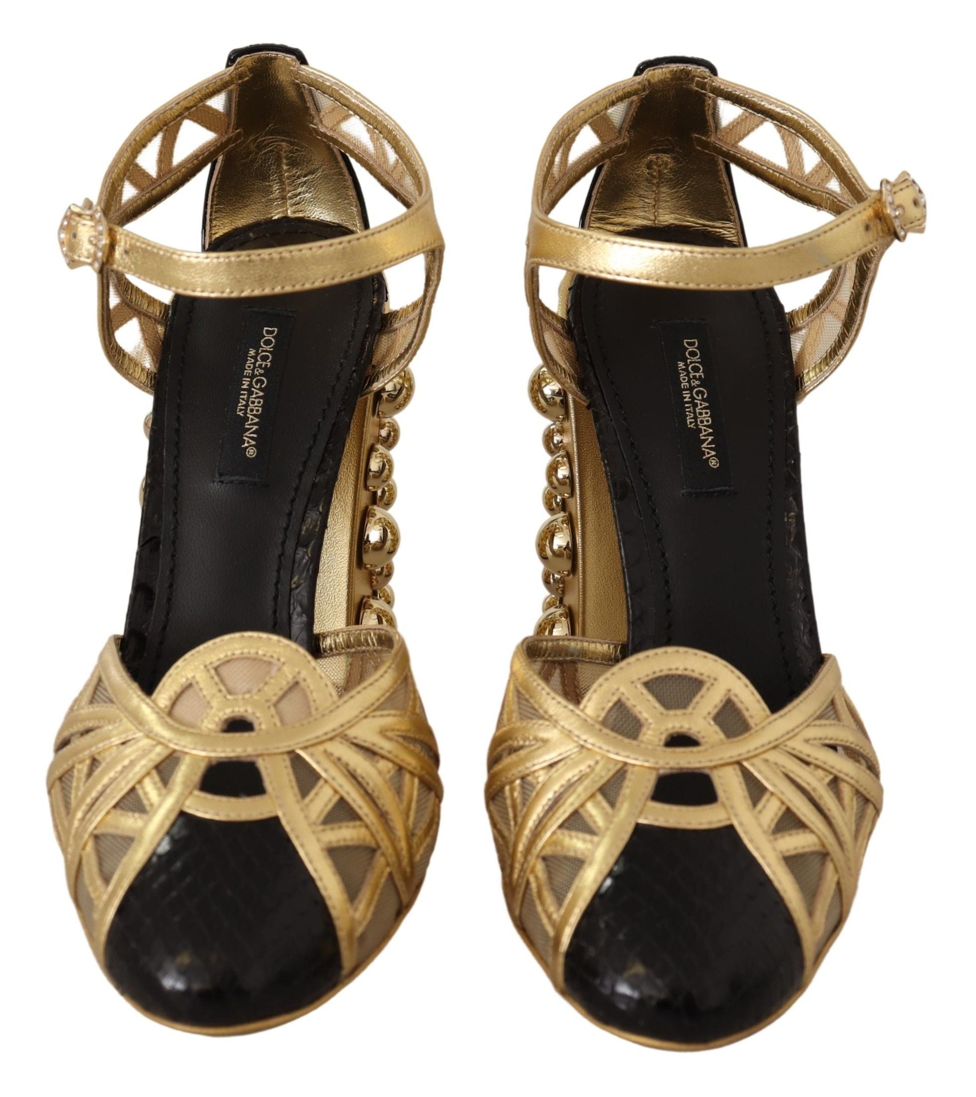 Black gold leather studded ankle strap shoes by Dolce & Gabbana, featuring pointed toes and decorative metal studs.