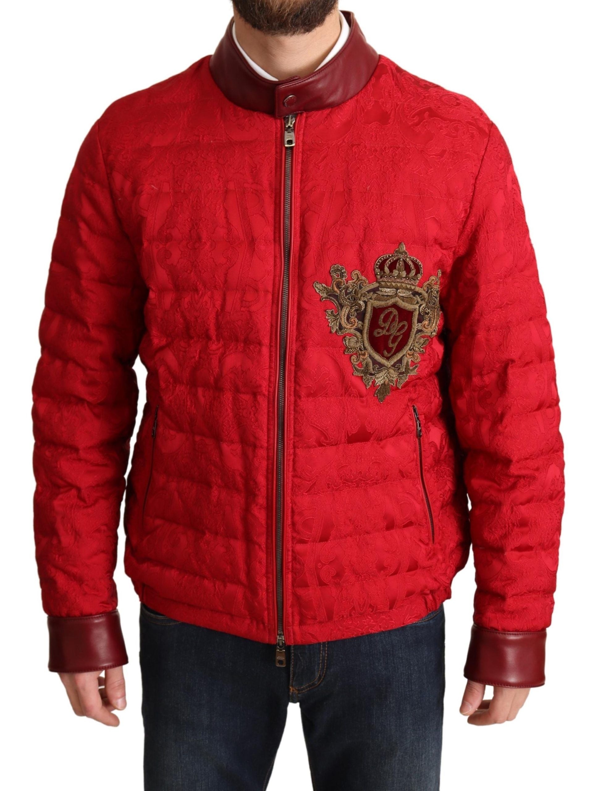 Red brocade bomber jacket with gold crown logo from Dolce & Gabbana, featuring intricate pattern and stylish design.