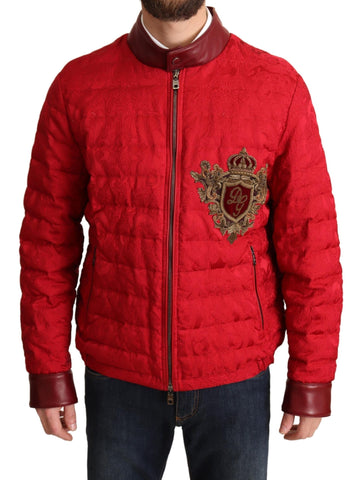 Red brocade bomber jacket with gold crown logo from Dolce & Gabbana, featuring intricate pattern and stylish design.