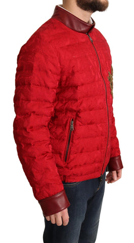 Red brocade bomber jacket with gold crown logo from Dolce & Gabbana, featuring intricate patterns and a stylish fit.