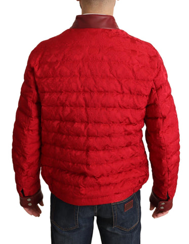 Red brocade bomber jacket with gold crown logo, Dolce & Gabbana coat featuring intricate pattern and stylish design.