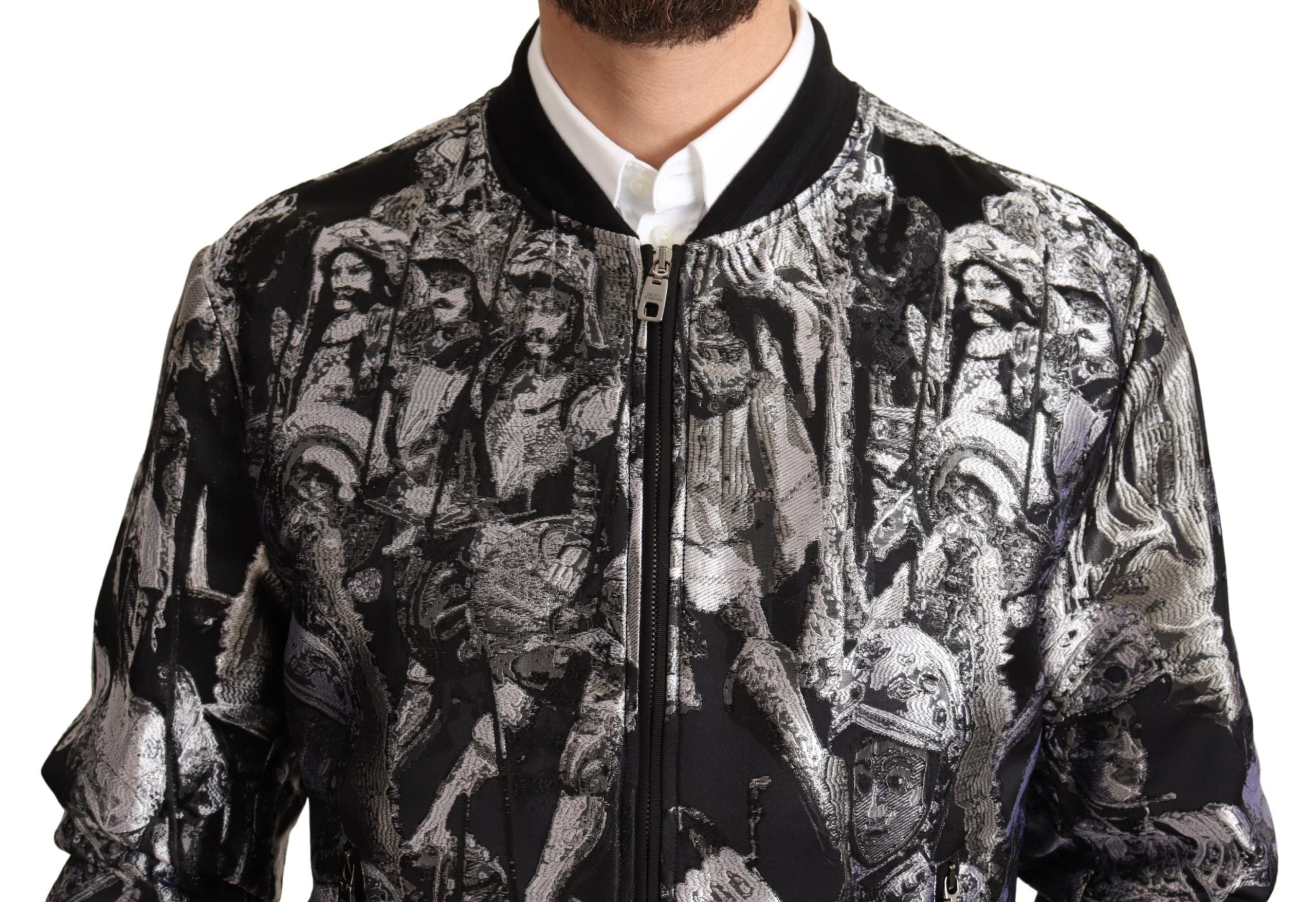 Black and silver Puppi Motive bomber jacket by Dolce & Gabbana with embroidered design, ribbed cuffs, and front zipper closure.