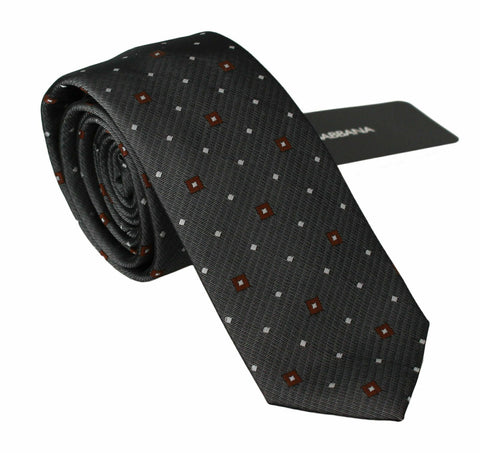 Gray patterned classic men's slim necktie by Dolce & Gabbana, featuring a stylish design ideal for formal or business wear.