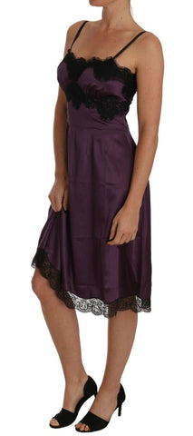 Purple silk stretch A-line dress with black lace detailing by Dolce & Gabbana, shown on a model.