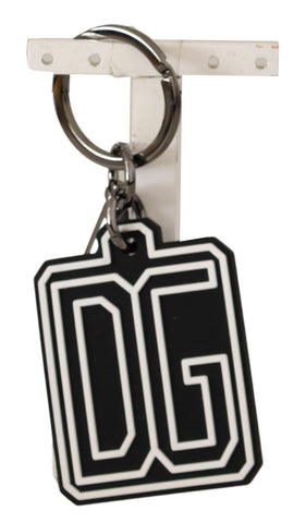 Black and white Dolce & Gabbana rubber logo silver ring keychain with branded design and metal ring attachment.