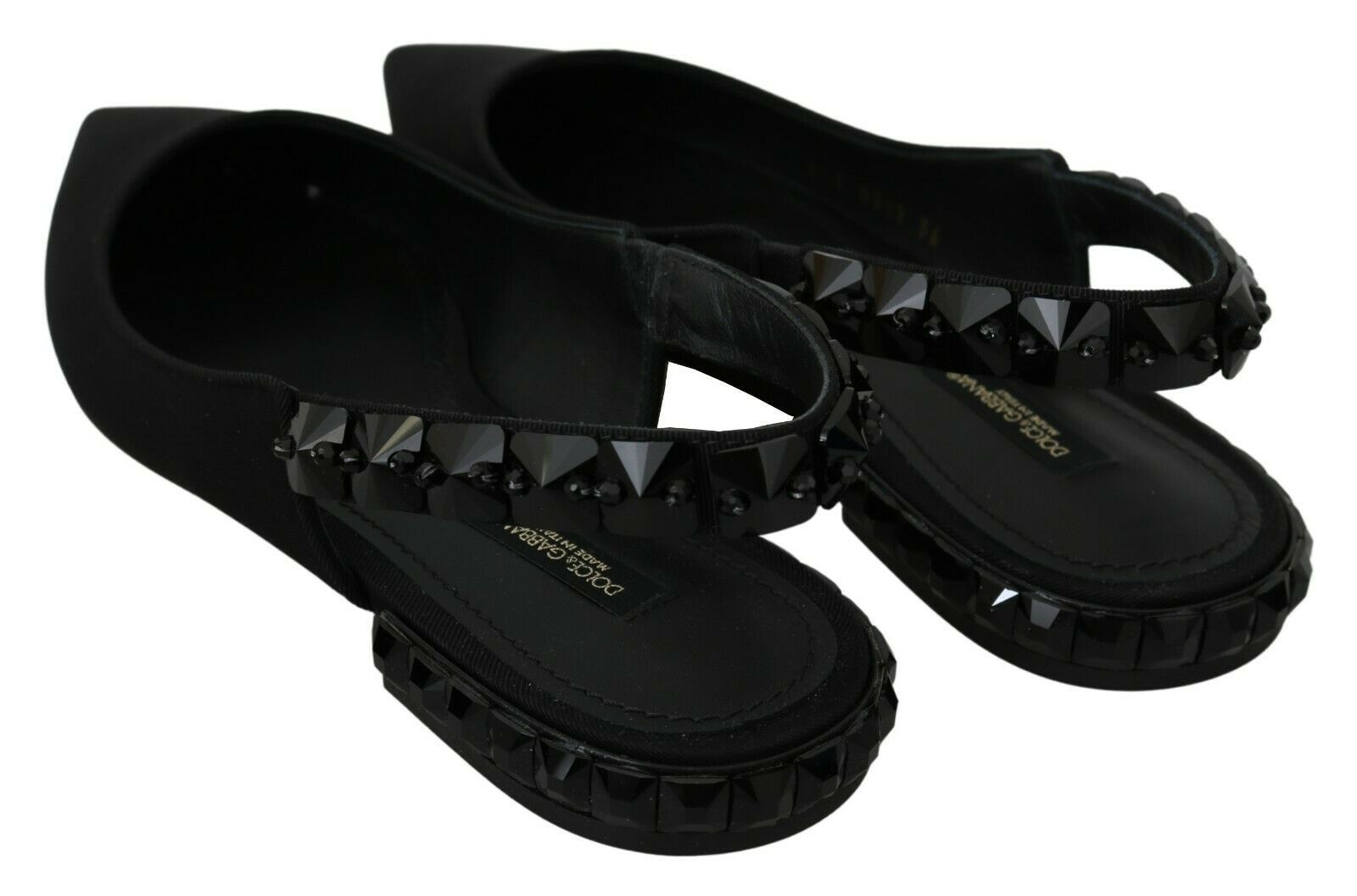 Black Dolce & Gabbana slingback flats made of charmeuse fabric, featuring a sleek and elegant design.