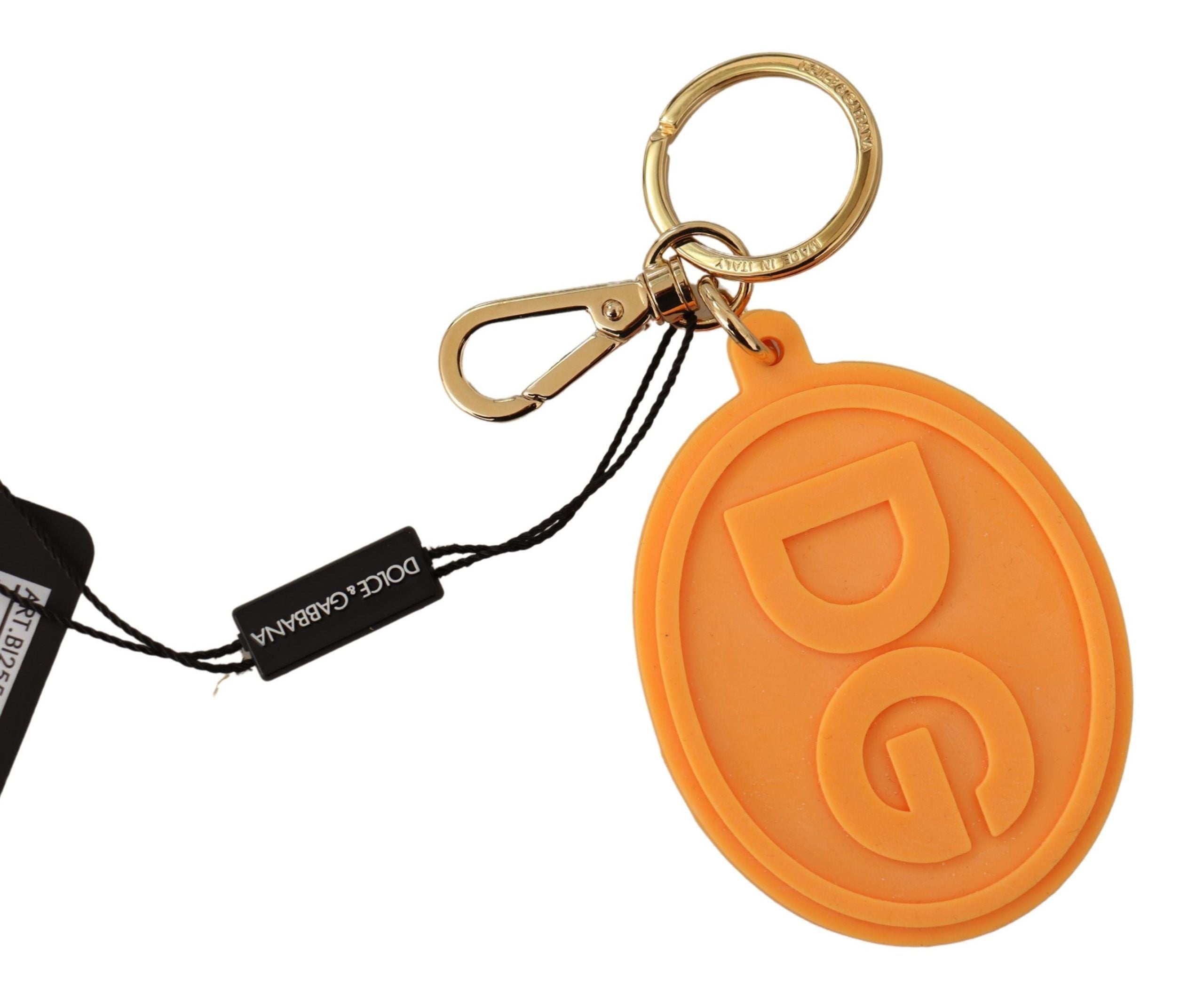 Orange rubber Dolce & Gabbana keychain with gold brass DG logo, featuring a stylish and durable jewelry accessory.