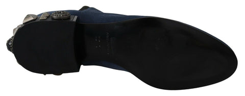 Blue suede studded boots with embellishments from Dolce & Gabbana, featuring a sleek design and decorative metal accents.