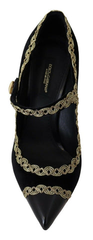 Black velvet Mary Jane pumps with embellishments from Dolce & Gabbana, featuring a classic strap and decorative details.