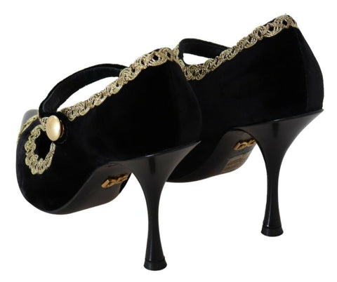 Black embellished velvet Mary Jane pumps by Dolce & Gabbana with decorative details and classic strap, perfect for elegant occasions.