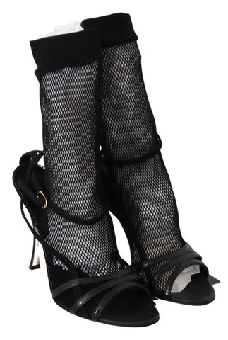 Black suede short boots sandals shoes by Dolce & Gabbana, featuring a sleek design and stylish ankle-high silhouette.